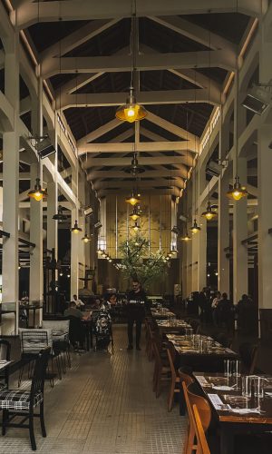 Spacious restaurant interior in Sicily with vintage design, ideal for dining experiences.